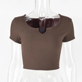 Close-up of brown rib-knit cotton fabric and notch neck detail on a slim fit crop top - S / Coffee