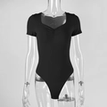 Detail of black short sleeve rib-knit bodysuit featuring a ruched V-neckline design - S / Black