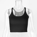 Detail of black ribbed knit crop top featuring a U-neck and vertical textured fabric - XS / Black