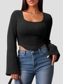 Detail view of black ribbed knit top with U-neckline and irregular V-cut hemline - XS / Black
