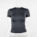 Front detail of black slim-fit cropped t-shirt with crew neck on transparent mannequin - S / Black