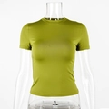 Detail of avocado green slim fit t-shirt with crew neck on a clear mannequin - Green