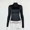 Detailed view of black slim-fit mock neck top with smooth elastic fabric and neat seams - S / Black