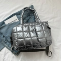 Chic silver quilted puffer tote bag with adjustable shoulder strap and padded finish - Gray