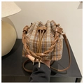 Close-up of plaid drawstring bucket bag with leather woven handle and wool texture - Brown No Pendant