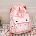 Pink drawstring backpack featuring a cute bunny print and a front buckle pocket - Rabbit Pink