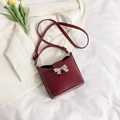 Elegant deep red matte leather handbag with silver butterfly buckle and shoulder strap - Red
