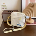 Sac bandoulière en toile blanc cassé avec étiquette FASHION et sangle réglable - Jaune