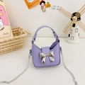 Charming purple mini handbag for girls featuring a metallic silver bow and chain strap - Purple
