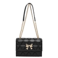 Chic black quilted shoulder bag with golden butterfly clasp and elegant chain strap - Black