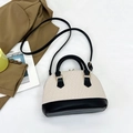 Contrast cream and black embossed shell bag with top handles and shoulder strap - Black and White