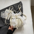 Chic cream mini backpack with large lace bow and gold hardware for stylish women - Off White
