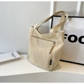 Detail of canvas tote with front zipper pocket and fashion woven label decoration - Khaki