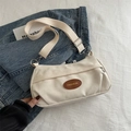 Chic beige canvas crossbody bag with adjustable wide strap and brown leather logo patch - White