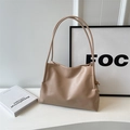 Minimalist beige soft leather tote bag with knotted side detail and slim shoulder strap - Khaki
