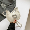 Beige crescent underarm bag with square rhinestone buckle and woven handle detail - White