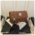 Detail of brown quilted bag with star ornament and silver chain strap for women - Brown