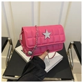 Close-up of hot pink quilted crossbody bag with luxury star buckle and silver chain strap - Rose Pink