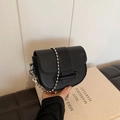 Chic black lychee grain saddle bag with stylish silver bead chain and magnetic flap closure - Black