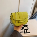 Fluorescent lime green leather saddle bag with silver bead chain and pebbled texture - Green