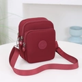 Bolso bandolera minimalista de nailon burdeos con múltiples cremalleras y correa ajustable - Rojo