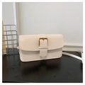 Detailed shot of a beige faux leather handbag featuring a prominent gold square buckle - Off White