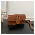 Detail of a brown leather shoulder bag featuring a prominent square gold buckle closure - Brown