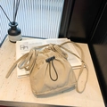 Minimalist khaki nylon drawstring crossbody bucket bag on marble table with magazine - 19.5*15.5*5cm / Khaki
