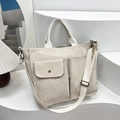 Beige corduroy tote bag with dual front pockets and adjustable shoulder strap for women - Beige