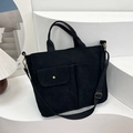 Black corduroy briefcase bag with adjustable shoulder strap and front pockets for daily commute - Black