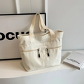 Borsa tote in tela bianco crema con due tasche frontali con zip e manici a contrasto neri - Bianco avorio