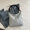 Silver pleated tote bag with wooden bead handle and golden zipper for casual use - Silver