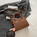 Brown corduroy crossbody bag featuring a vibrant red strawberry print and leather strap - Strawberry Print / Brown