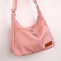 Pink waterproof nylon crossbody bag with multiple zippers and wide adjustable strap - Pink