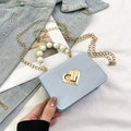 Light blue faux leather mini bag with pearl handle and golden heart lock detail - Blue