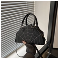 Detail of gothic black leather handbag with white spider web stitching and golden hooks - Black