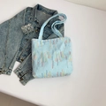 Light blue textured tote bag with colorful vertical stripes and dual shoulder straps - Blue