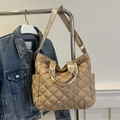 Beige quilted tote bag with spacious interior and wide nylon strap for versatile carrying - Khaki