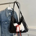 Black PU leather tote bag with a white plush puppy patch and a red drawstring bow - Black