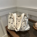 Chic beige corduroy tote bag with black diamond pattern and cute bow detail for women - Off White