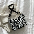 Plush zebra print tote bag with silver chain detail and black adjustable strap - Zebra Print