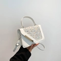 White elegant crossbody bag with colorful woven flap and gold metallic accents - White