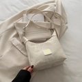 Minimalist beige dumpling shoulder bag with marble texture and adjustable strap - White without Charm