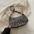Chic leopard print underarm bag with crescent shape and gold-tone metal hardware - Black