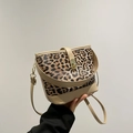 Leopard print bucket bag with tan leather trim and golden metal clasp handle - Khaki