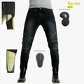 Detalle de forro de Kevlar y protecciones CE extraíbles en vaqueros de moto azules - XS / Negro