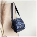 Detail of navy blue metallic quilted crossbody bag with FASHION label and wide strap - Sapphire