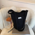Black wool bucket bag with 'Love Fashion' label and cute plush puppy charm accessory - Black With Pendant