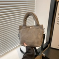 Gray corduroy bucket bag with top handle, white button, and adjustable shoulder strap - Gray