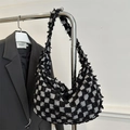Fashionable black and white checkerboard half-moon crossbody bag with tassel fringe edges - Black
